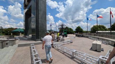 Installation of supplementary projection surfaces on site at the Memorial in preparation for the event.