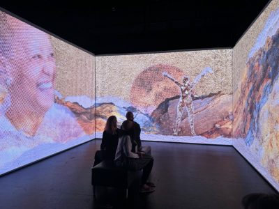 Three people attend Nikki Giovanni’s June immersive experience in the Cube at the Center for the Arts. Photo by Meaghan Dee for Virginia Tech.